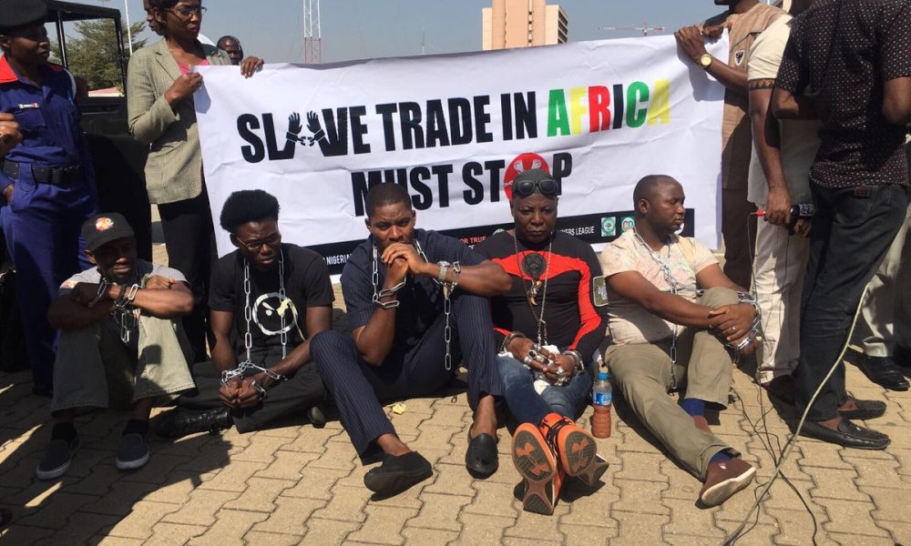 Charlie Boy and co in handcuff as they protest agains slave Trade In Libya