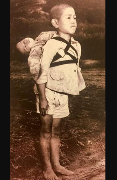 Pope Orders Image Of A Young Boy Carrying His Dead Brother After A Bomb Explosion Be Printed And Distrubuted
