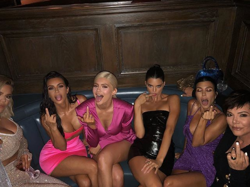 Kourtney Kardashian took to Instagram to wish her kid sister, Kylie Jenner a happy birthday, but social media users feel the message is inappropriate. Sharing a photo of the entire Kardashian/Jenner sisters and their mother giving the middle finger, Kourtney wrote: "happy fucking birthday bitch."