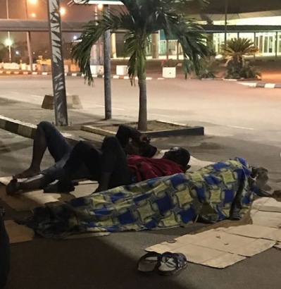 Travelers Sleep By Roadside After Staff At Abuja Airport Allegedly Pushed Them Out