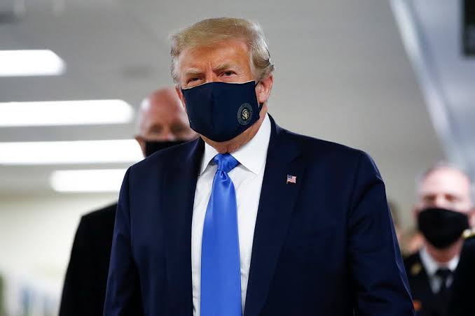 President Donald Trump wears face mask for the first time in public