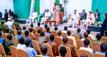 In this picture taken on December 18, 2020, President Muhammadu Buhari addresses the abducted students in Kankara following their release by their captors.