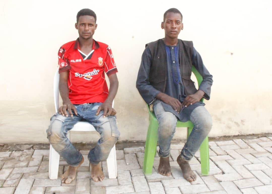 A photo released by the Nigeria Police Force on December 10, 2020, shows two suspected members of a transnational kidnap syndicate who abducted a United States citizen in October.