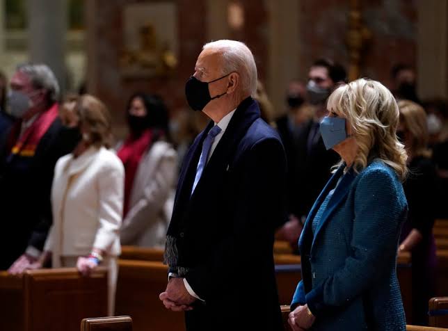 President-elect Joe Biden and his wife, Jill Biden, attend Mass at the Cathedral of St. Matthew the Apostle ahead of his inauguration as the nation's 46th president on Jan. 20, 2021. EVAN VUCCI / AP