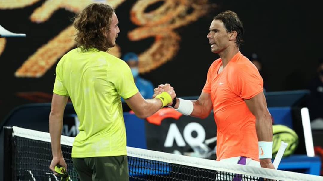 Greece’s Stefanos Tsitsipas (R) shakes hands with Spain’s Rafael Nadal after their men’s singles quarter-final match on day ten of the Australian Open tennis tournament in Melbourne on February 17, 2021. PHOTO: DAVID GRAY / AFP