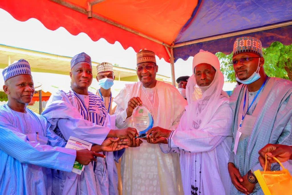 Executive Vice Chairman, Nigerian Communications Commission (NCC), Prof. Umar Garba Danbatta (centre) flanked by traditional rulers and community leaders of Danbatta community during the presentation of recognition award to him in Kano over the weekend.