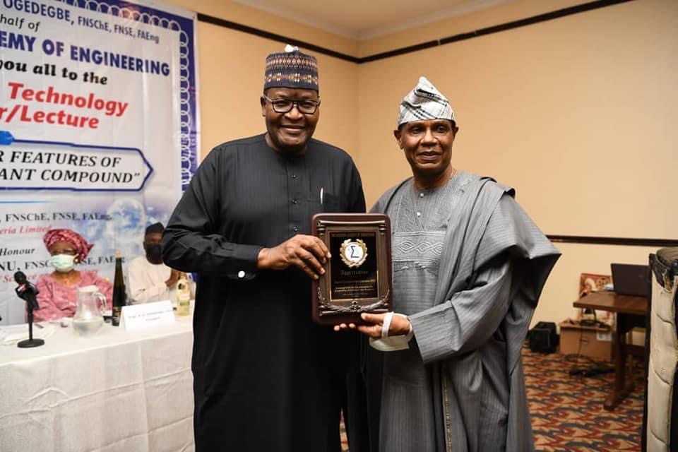 Executive Vice Chairman/CEO, Nigerian Communications Commission (NCC), Prof. Umar Garba Danbatta (Left) receiving the recognition award from President, National Academy of Engineerring (NAE), Engr. Alex Ogedengbe.