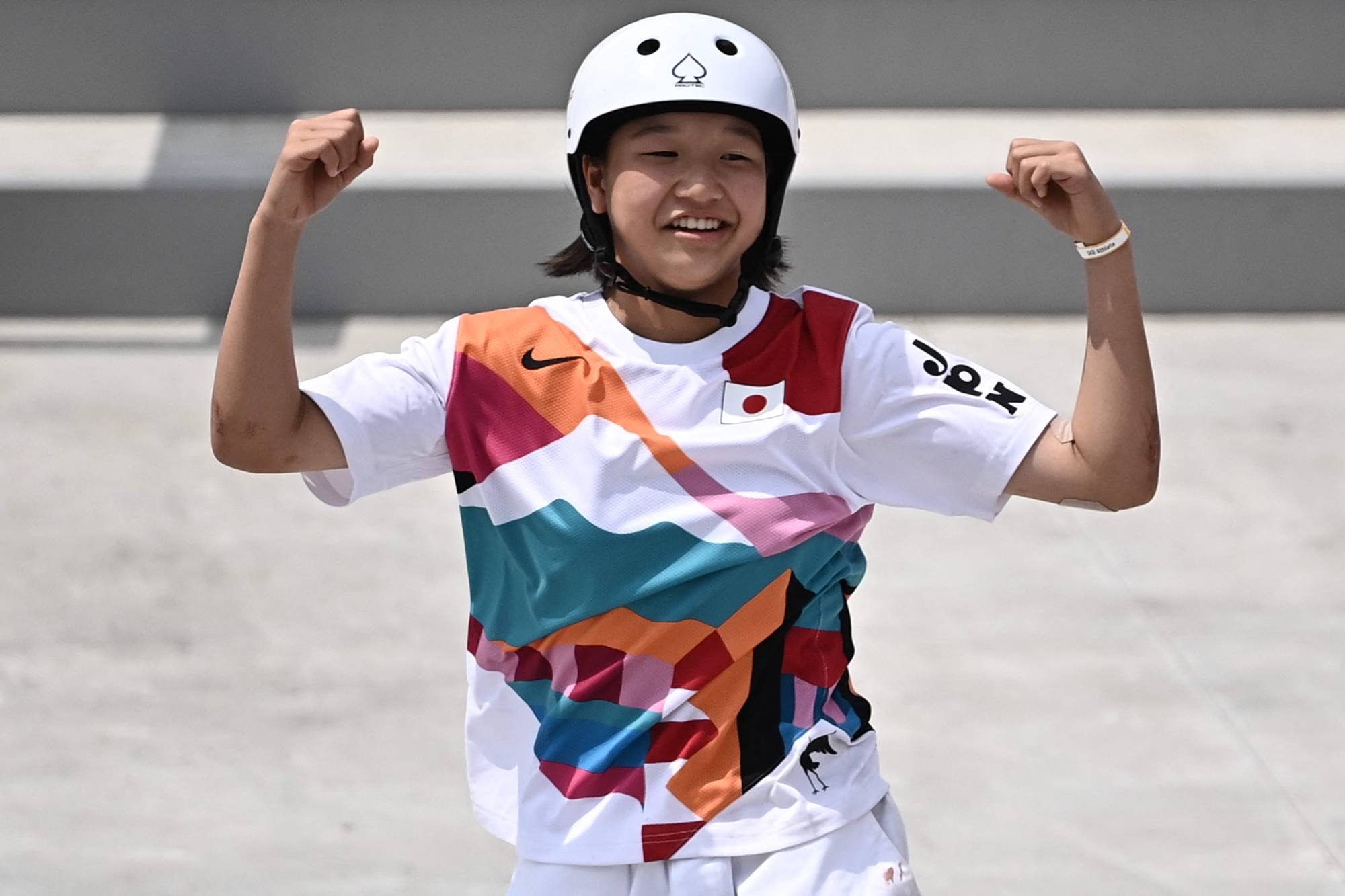 Japan’s Momiji Nishiya celebrates after performing a trick during the skateboarding women’s street final in Tokyo on Monday. The 13-year-old took gold in the competition. | AFP-JIJI
