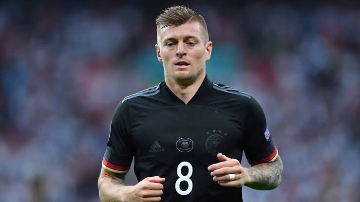 FILES) In this file photo taken on June 29, 2021 Germany’s midfielder Toni Kroos jogs during the UEFA EURO 2020 round of 16 football match between England and Germany at Wembley Stadium in London. – Toni Kroos announced on July 2, 2021 he was retiring from Germany’s national football team, days after the team was knocked out of Euro 2020 by England. (Photo by JUSTIN TALLIS / POOL / AFP)